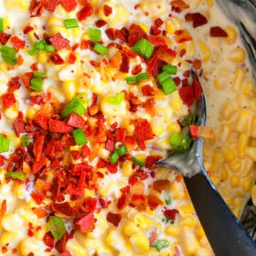 Easy Creamed Corn with Bacon in Black Slow Cooker.