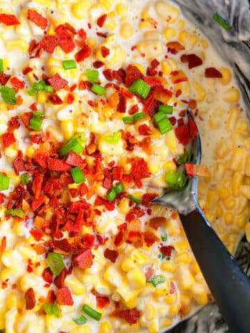 Easy Creamed Corn with Bacon in Black Slow Cooker.