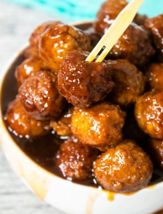 Easy Slow Cooker Grape Jelly Meatballs in White Bowl