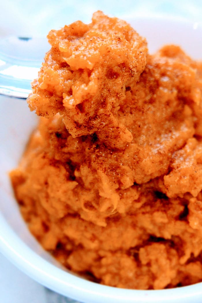 Closeup Shot of Cinnamon Mashed Sweet Potatoes on a Silver Spoon