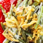 Easy Crockpot Thanksgiving Green Bean Casserole Served in Red Dish