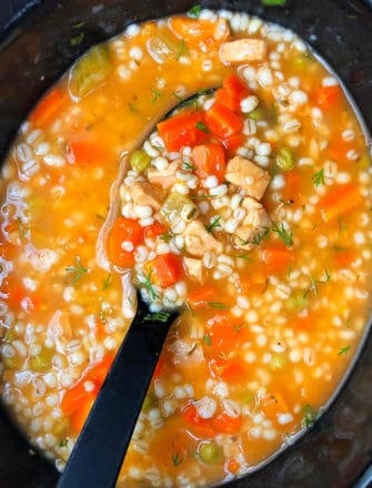Easy Homemade Chicken Barley Soup in Black Slow Cooker