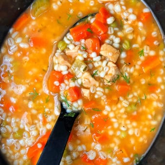 Easy Homemade Chicken Barley Soup in Black Slow Cooker
