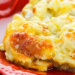 Homemade Crockpot Cheesy Shredded Hashbrown Casserole in Red Plate