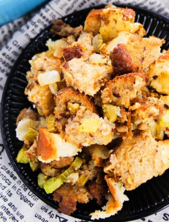 Easy Homemade Sausage Stuffing Made in Slow Cooker Served in Black Plate