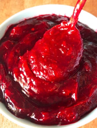 Easy Homemade Slow Cooker Cranberry Sauce with Orange Marmalade in White Bowl- Closeup Shot