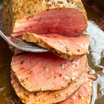 Easy Homemade Slow Cooker Roast Beef With Fork Separating Slice