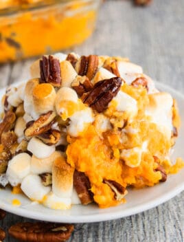 Easy Homemade Sweet Potato Casserole Prepared in Crockpot and Served in White Plate
