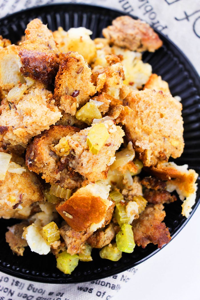Easy Slow Cooker Sausage Stuffing Served in Black Plate- Overhead Shot