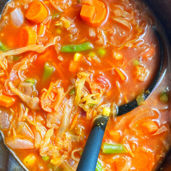 Easy Homemade Cabbage Soup in Black Slow Cooker- Overhead Shot