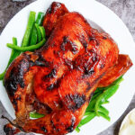 Slow Cooker Tandoori Chicken on White Plate with Gray Background