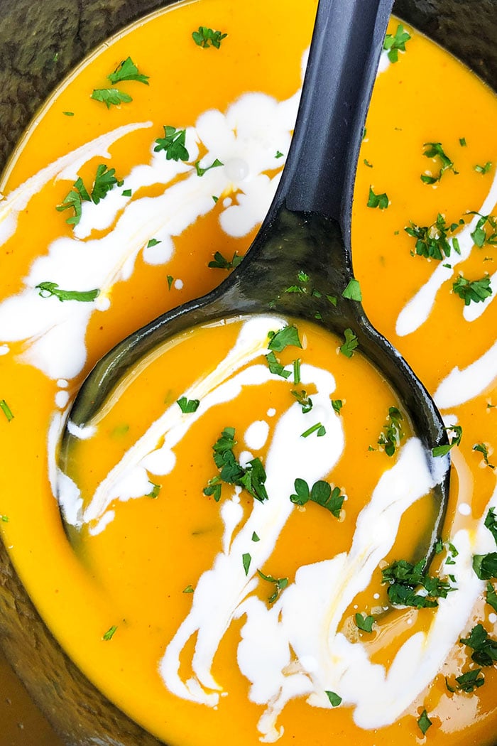 Slow Cooker Butternut Soup With Swirls of Heavy Cream and Parsley