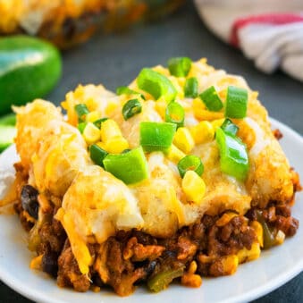 Easy Mexican Slow Cooker Tater Tot Casserole With Ground Beef Served in White Plate