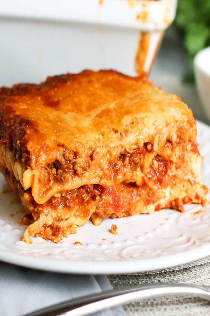 White Plate With a Slice of Slow Cooker Lasagna