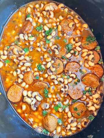 Easy Black Eyed Peas With Sausage and Ham in Black Slow Cooker- Overhead Shot