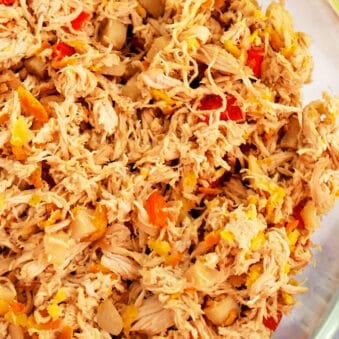 Easy Slow Cooker Shredded Asian Chicken Served in a Glass Bowl