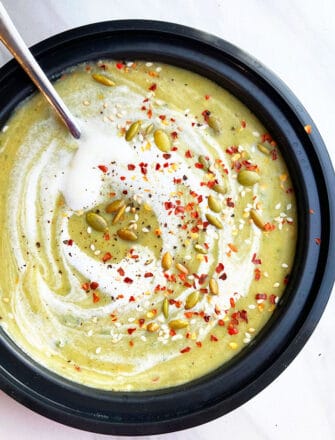 Easy Slow Cooker Cream of Asparagus Soup Served in Black Bowl
