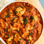 Slow Cooker Spicy Curry With Chicken Served in White Bowl