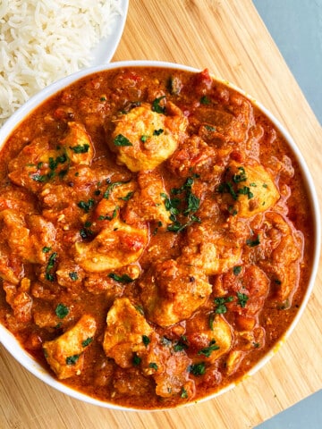 Slow Cooker Spicy Curry With Chicken Served in White Bowl