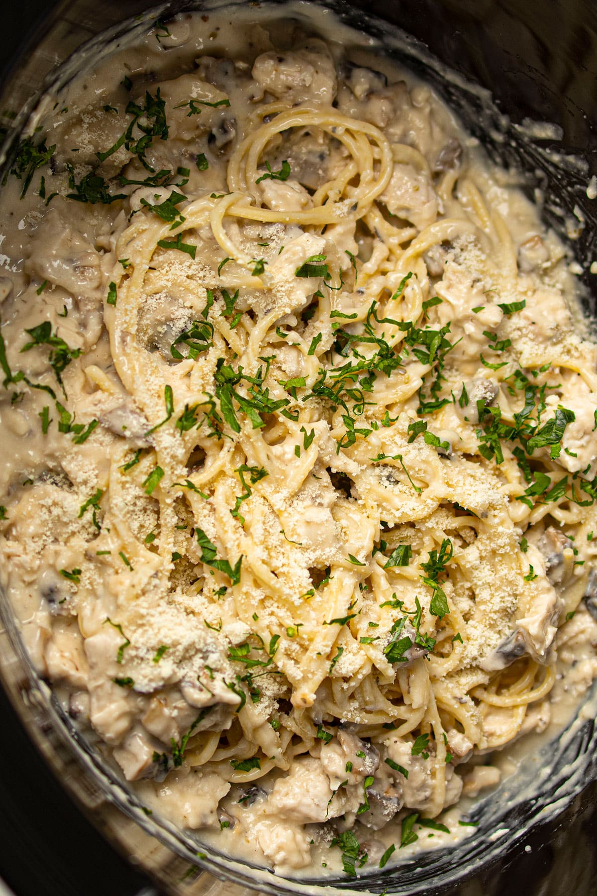 Easy Creamy Slow Cooker Chicken Bacon Ranch Pasta With Parsley Garnish- Overhead Shot.
