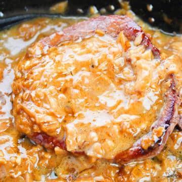 Gravy mixture coating the meat in crockpot. 