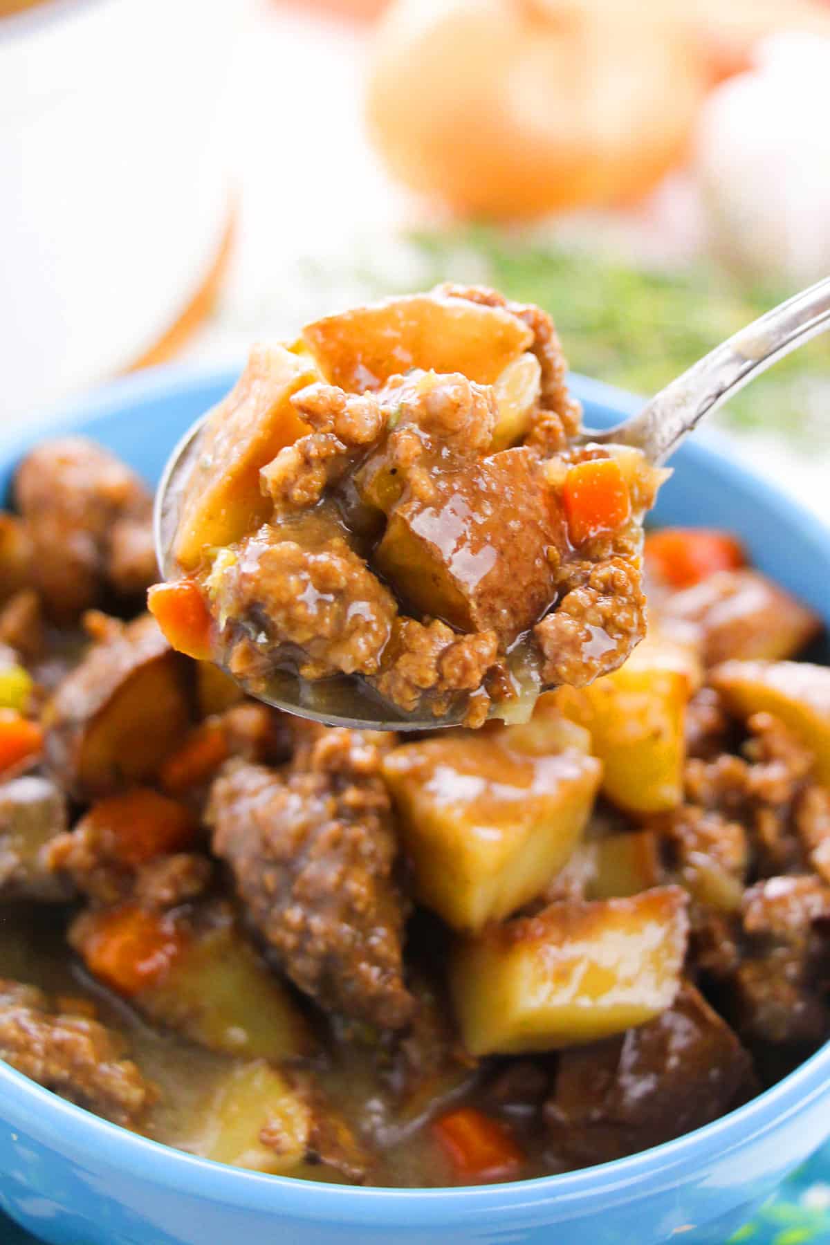 Spoonful of hamburger stew- Closeup shot. 