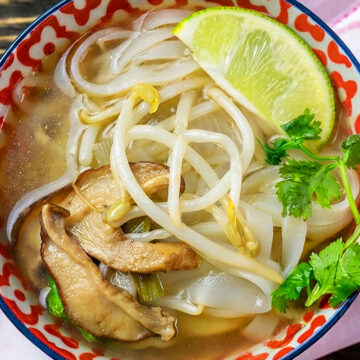 Broth served in bowl with lots of toppings. 